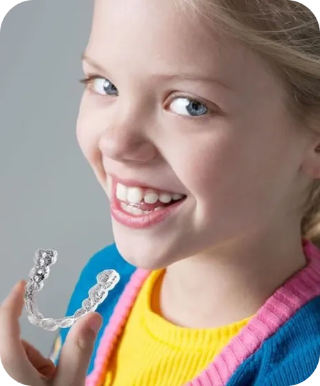 Smiling Child with Invisalign